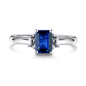 3 CT. Emerald Cut Blue Sapphire and White Sapphire Three Stone Ring